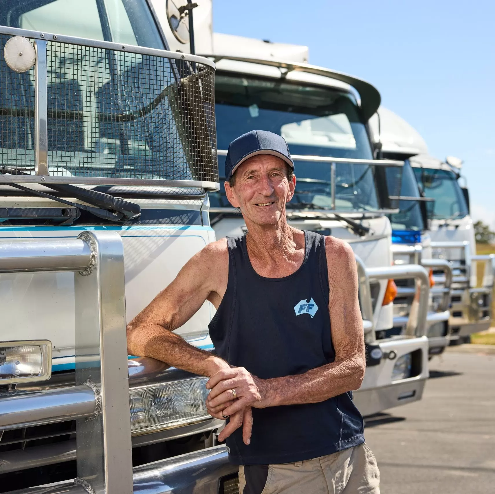 Man posed with trucks
